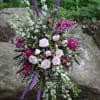 A beautiful spray in colors of whites, soft pink, and magenta purple.