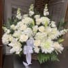 All white arrangements, white roses, white spiders, white stock, white hydrangeas, white