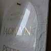 This beautifully textured background adds a unique dimension to an arch-shaped acrylic