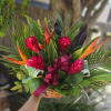 This beautiful tropical floral basket is beaming with bright colors and an