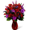 Love makes the world go round and this fresh flower arrangement is