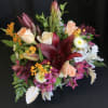 A gorgeous mixed arrangement with contrasting colors. Color and flower varieties are