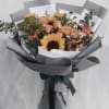This lovely handthight bouquet has a mix of flowers, fillers and greenery