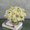 This dreamy white floral mix is heavenly. The cylinder glass vase holds