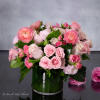 A stunning blend of pinks, creams, and touches of greens are combined