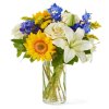 This celestial blend of white, yellow, and blue flowers evokes the beauty
