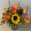 Orange roses, sunflowers, purple statice, green button, orange alstroemerias, red carnations, purple