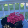 Pink roses in a heart shaped box with chocolates 
