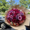Imagine a bouquet where elegance meets charm in a symphony of roses