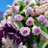 A all purple standing funeral spray designed for a memorial and funeral