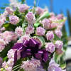 A all purple standing funeral spray designed for a memorial and funeral