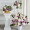 Featuring heartwarming lavenders and whites, the traditional arrangements of this sympathy set