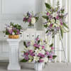 Featuring heartwarming lavenders and whites, the traditional arrangements of this sympathy set