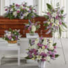 Featuring heartwarming lavenders and whites, the traditional arrangements of this sympathy set