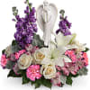 Show your sympathies with Angel Love. This design has lilies, roses, carns