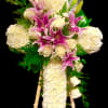 This design includes White Carnations, A dozen White Roses, Pink Lilies, &amp;
