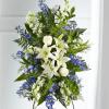 A collection of bold blue flowers shares a tribute that words cannot