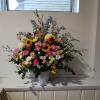 Beautiful sympathy basket with sunflowers, pale pink carnations, pink roses and delphinium