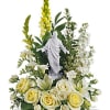 This inspiring piece is filled with white lilies, stock, spray roses and
