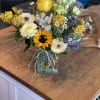 Send healing vibes with this cheerful arrangement, includes in season yellow and