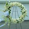 A beautiful white and green tribute wreath that calms, this easel arrangement