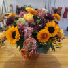 Beautiful earthy and sunny colors flowers in vase arrangment
