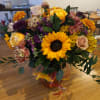Beautiful earthy and sunny colors flowers in vase arrangment