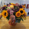 Beautiful earthy and sunny colors flowers in vase arrangment