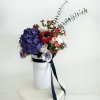 The &quot;Patriotic Elegance Vase&quot; is a striking floral arrangement that embodies bold