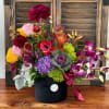 Cocktail of colorful flowers, in  black vase modern style.