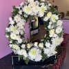 Standing Spray to be displayed beside a casket. White blooms arranged in