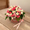 The Charm bouquet features delicate white and bright pink spray roses arranged
