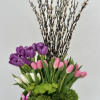 Introducing a chic vase adorned with a delightful arrangement of purple, pink