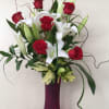 3 White Lilies , 6 Red Roses in pink glass vase 