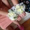 White flowers on a lase and white ribbon 