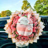 
A charming bouquet of vibrant red roses delicately arranged, complemented by lush
