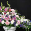 purple larkspur, pink lilies, pink roses, and various white flowers