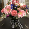 Everyday delight. Gerbera daisies, carnations, snapdragons, irises or other seasonal flower in