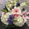 Lavender, White, Pink flowers with lilies, gerbera daisies, snaps...this lovely vase will