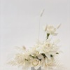- Epitomizes elegance with a purely white composition
- Features exquisite roses, delicate
