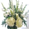 This design will have a mixture of beautiful white in season blooms