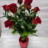 12 red roses,  with a  red base  and greeneries
