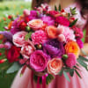 Experience the symphony of colors with the Vibrant Harmony Bouquet. This exquisite