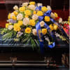 Creamy Roses, golden roses, and lush blue delphinium reflect the love we