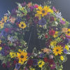 Let us design a beautiful standing sympathy wreath in seasonal flowers to