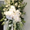 a small standing spray of white flowers