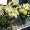 3 coffee table arrangements in whites and greens