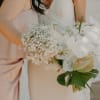 - Stunning bridal bouquet blending crisp whites and lush greens with a