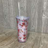 Acrylic travel cup with fun smiling snails, mushrooms, and butterflies. There are