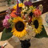 Yellow Sunflowers,pink hydrangeas, white snapdragons, orange roses, beebalm, yellow solidago aster.
